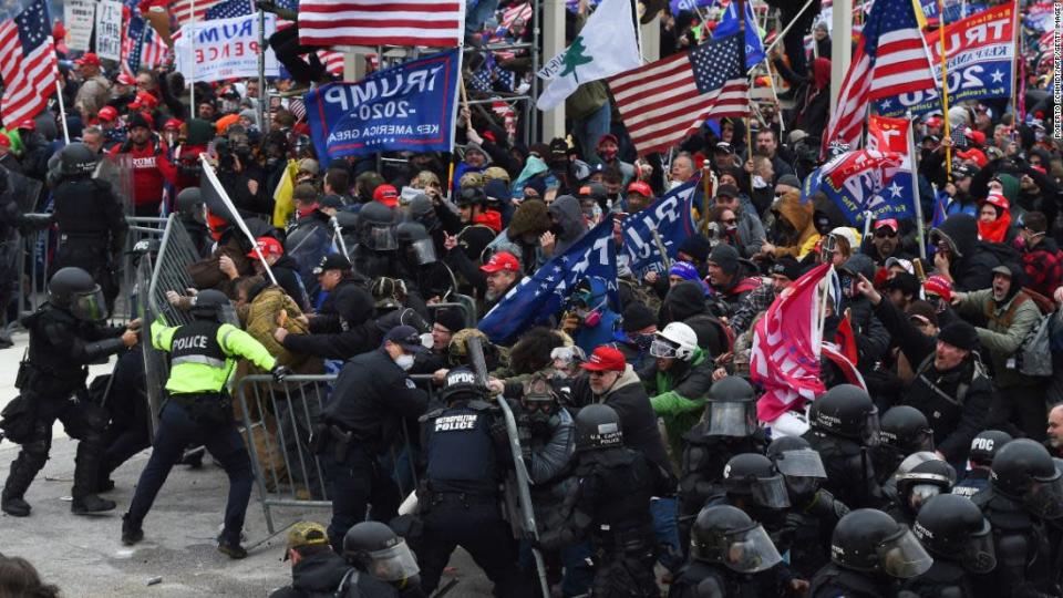 <p>Trump supporters clash with police and security forces as they push barricades to storm the US Capitol in Washington on Wednesday, January 6.</p><div class="cnn--image__credit"><em><small>Credit: Roberto Schmidt/AFP/Getty Images / Getty</small></em></div>