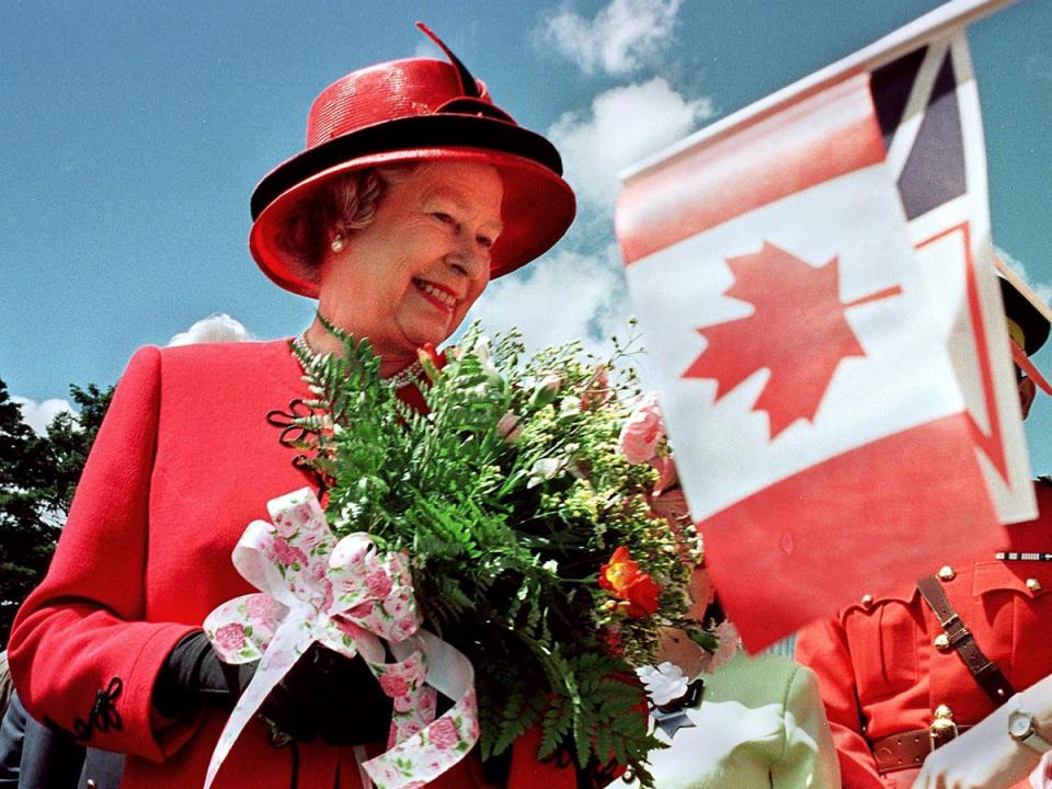 Queen Elizabeth II smiles as she visits Bowring Park in St. John's, Newfoundland, on the third day of a 10-day official visit to Canada, 1997 (Getty)