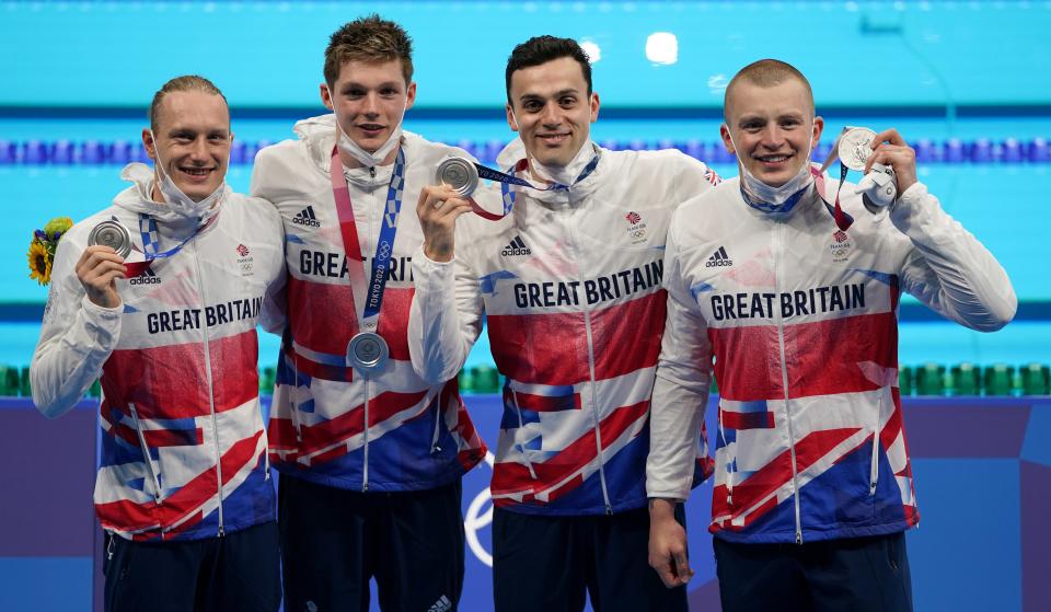 Great Britain’s (left-right) Luke Greenbank, Duncan Scott, James Guy and Adam Peaty after winning the silver medal in the men’s 4x100m medley relay (Joe Giddens/PA) (PA Wire)