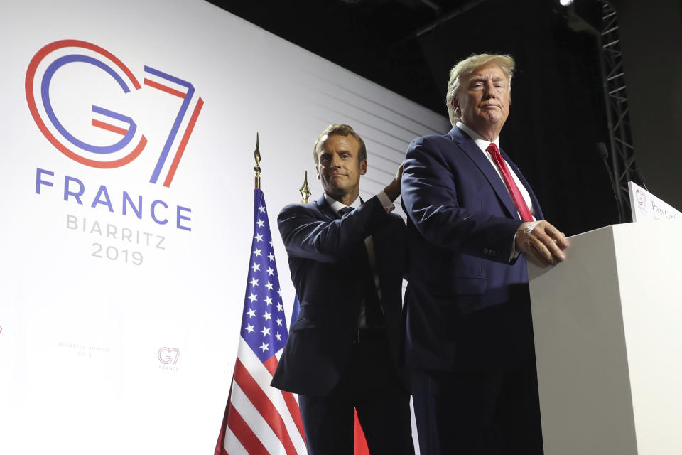 President Donald Trump and French President Emmanuel Macron wrap up a joint press conference at the G-7 summit in Biarritz, France, Monday, Aug. 26, 2019. (AP Photo/Andrew Harnik)