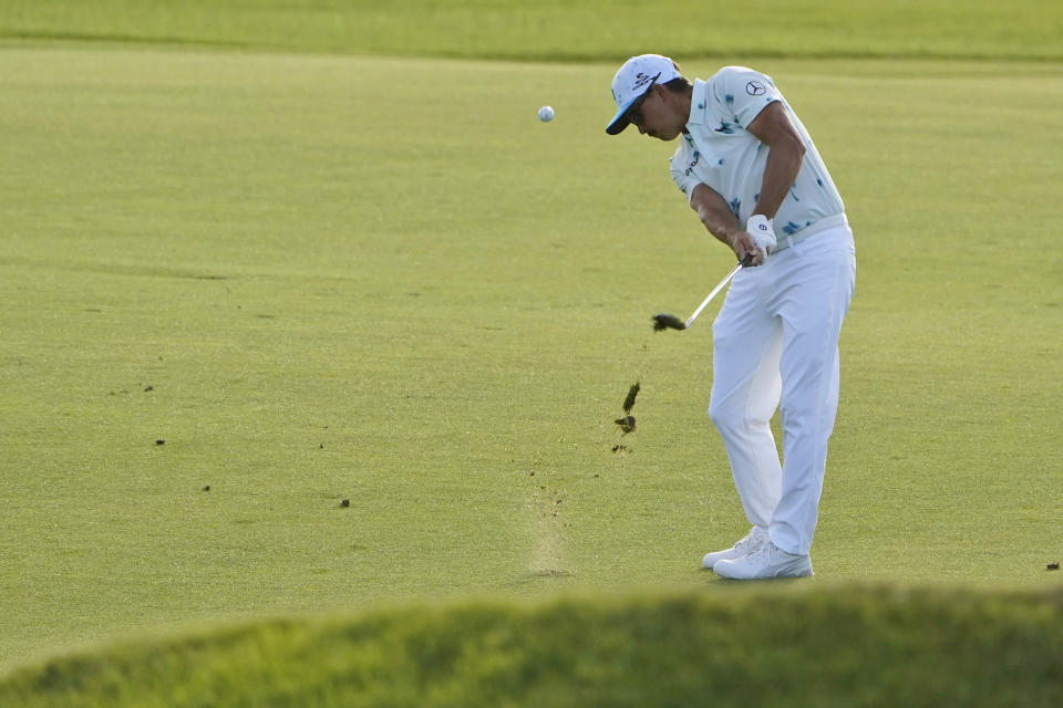Rickie Fowler takes his second shot on the 11th hole during the first round of the PGA Championship golf tournament on the Ocean Course Thursday, May 20, 2021, in Kiawah Island, S.C. (AP Photo/Chris Carlson)