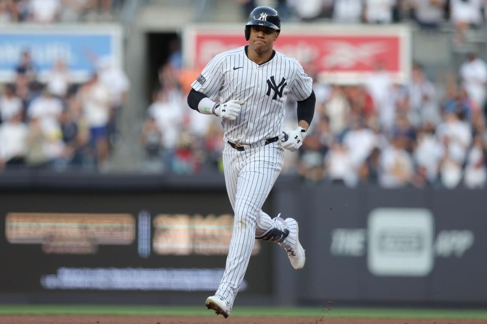 New York Yankees right fielder Juan Soto (22) rounds the bases after hitting a two run home run against the Houston Astros during the first inning at Yankee Stadium.