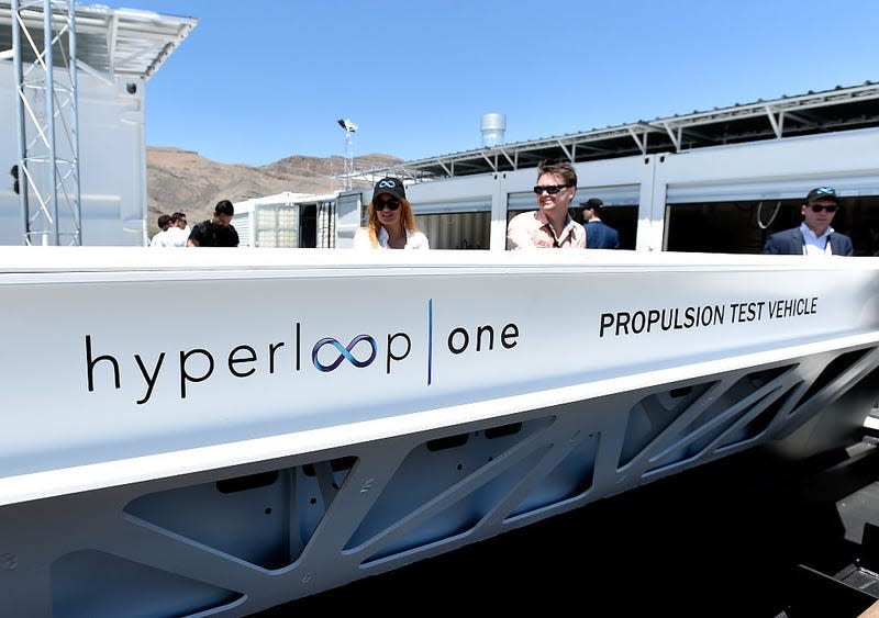 NORTH LAS VEGAS, NV - MAY 11: People look at a demostration test sled after the first test of the propulsion system at the Hyperloop One Test and Safety site on May 11, 2016 in North Las Vegas, Nevada. The company plans to create a fully operational hyperloop system by 2020.