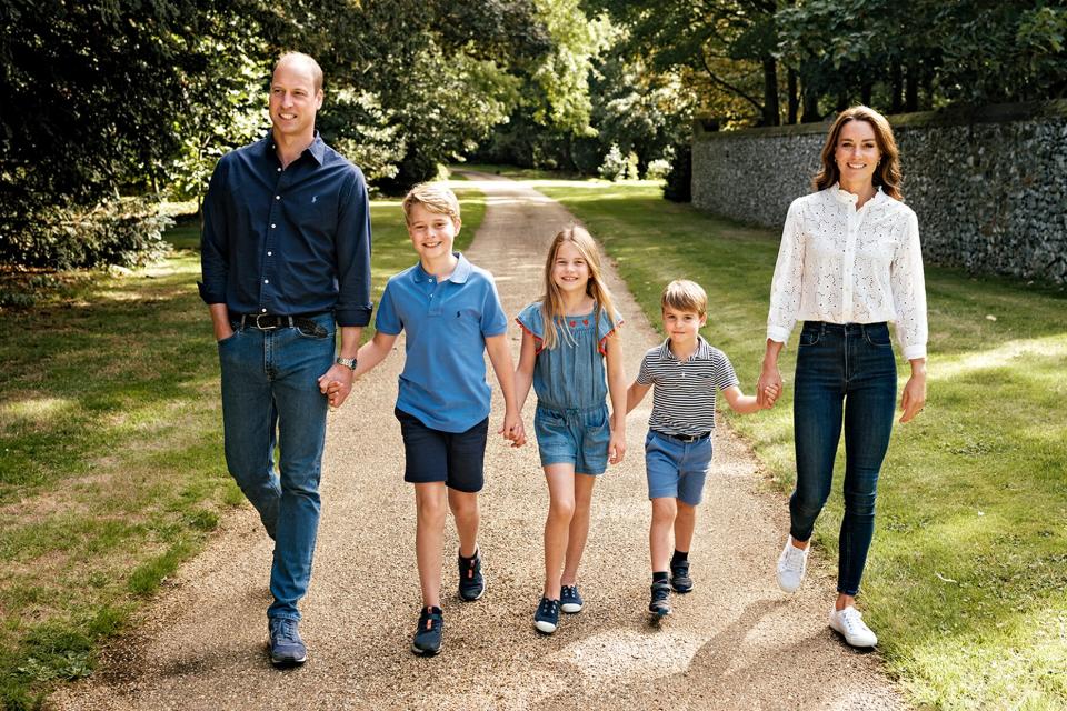 Prince William, Prince of Wales and Catherine, Princess of Wales and their three children Prince George, Princess Charlotte and Prince Louis are seen in Norfolk, England. The photograph, which features on their Royal Highnesses' Christmas card this year, was taken by the photographer Matt Porteous earlier this year.