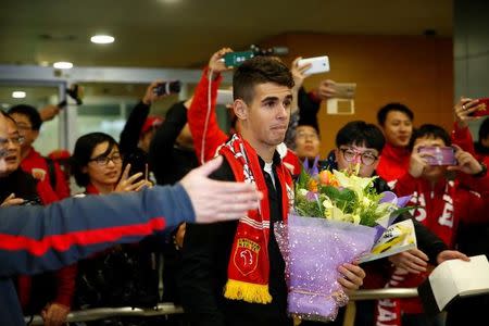 Brazilian international midfielder Oscar arrives at the Shanghai Pudong International Airport, after agreeing to join China super league football club Shanghai SIPG from Chelsea in Shanghai, China, January 2, 2017. REUTERS/Aly Song