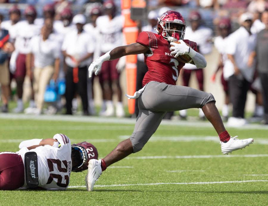 Virginia Union running back Jada Byers breaks the tackle of Morehouse’s Cameron Selders as he runs for a first-half touchdown in the Black College Football Hall of Fame Classic on Sept. 3 in Canton. (Credit: Kevin Whitlock / Massillon Independent / USA Today Network)
