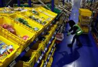 An employee works at RedMart's fulfillment centre in Singapore September 22, 2017. REUTERS/Edgar Su