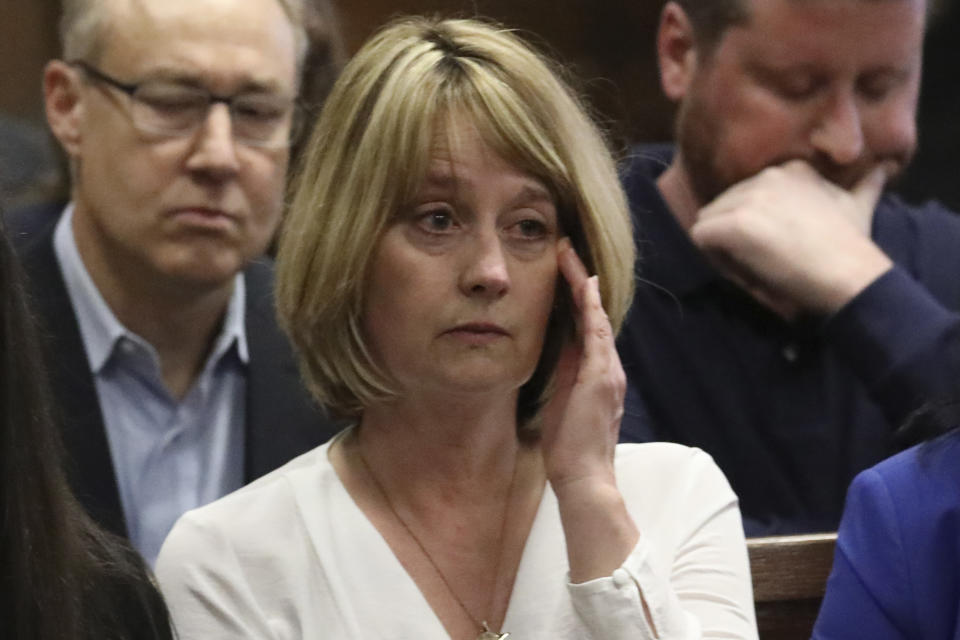 Chicago Police Cmdr. Paul Bauer's widow Erin Bauer listens during Shomari Legghette's murder trial at the Leighton Criminal Courthouse, Friday, March 13, 2020, in Chicago. Legghette, on Friday, was found guilty of first-degree murder in the Feb. 13, 2018, killing of Bauer. (Antonio Perez/Chicago Tribune via AP, Pool)