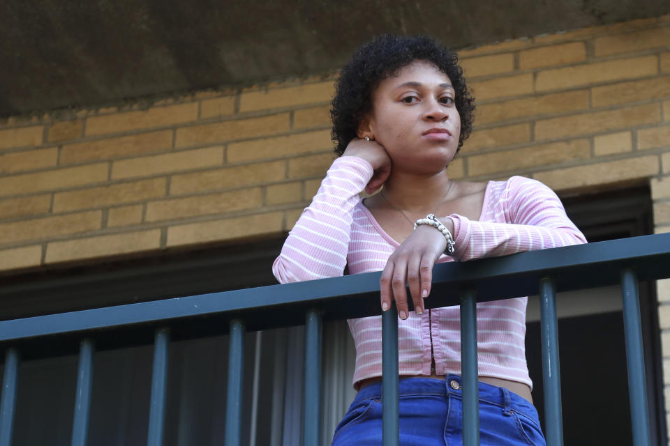 FILE - This March 31, 2020 photo shows Jade Brooks at her apartment in Boston. Brooks and her family have counted on an eviction moratorium in Massachusetts to get them through the pandemic. Still, 22-year-old Brooks worries: How long will it last? Brooks’ mother hasn't found find full-time work since losing her insurance-company job. And Brooks doesn’t get paid enough as a hospital switchboard operator to cover rent _ recently raised to $2,075 monthly _ for their two-bedroom Boston apartment.(AP Photo/Elise Amendola)