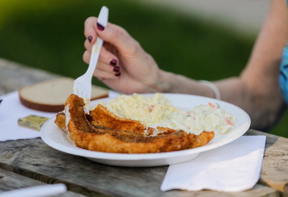 Thousands of people crowd Lakeside Park Friday, June 7, 2019 in Fond du Lac, Wis. to take part in Walleye Weekend.