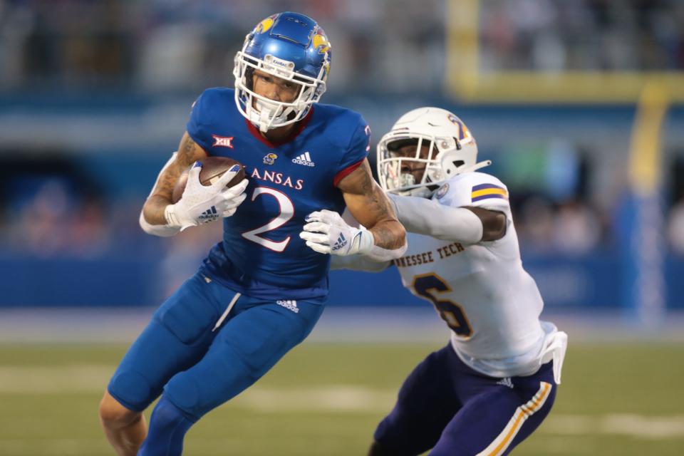 Kansas redshirt sophomore wide receiver Lawrence Arnold (2) gains yards after a completed pass during the first half of Friday's game against Tennessee Tech at David Booth Kansas Memorial Stadium.