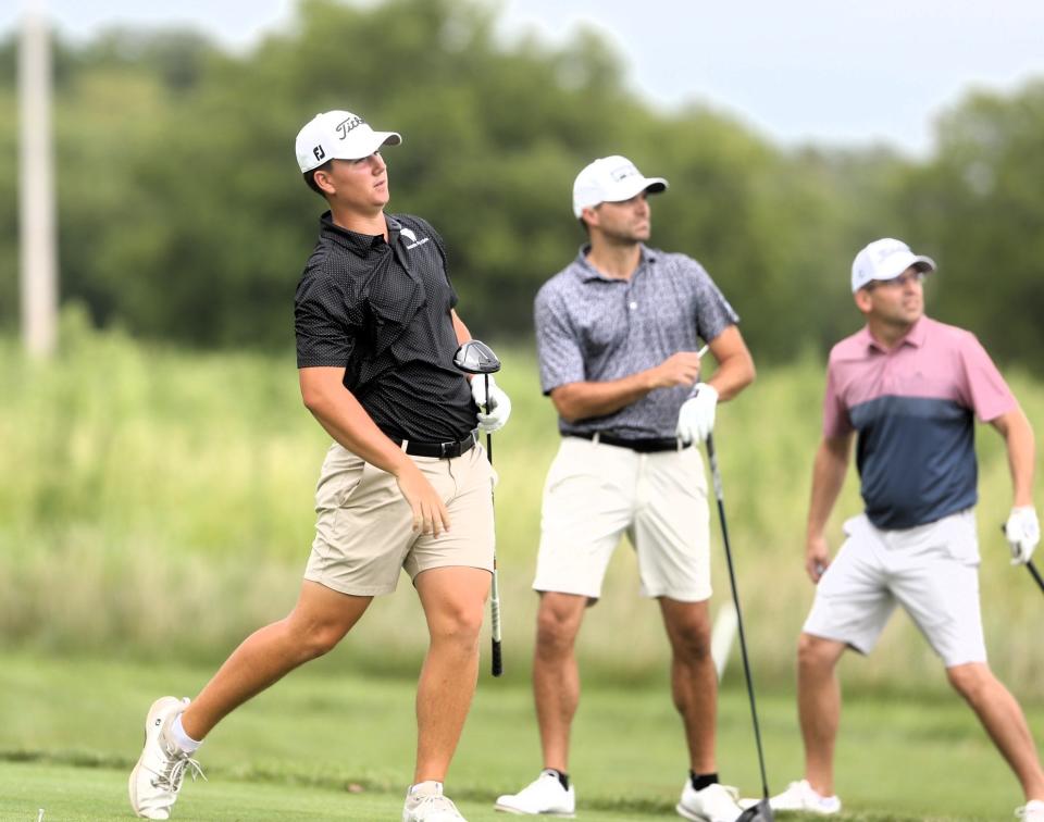 Dain Richie watches his tee shot alongside Jake Erickson (middle) and Bobby Sobieski (far right) on No. 6 during the final round of the Men's City golf tournament at Panther Creek Country Club on Sunday, August 6, 2023.