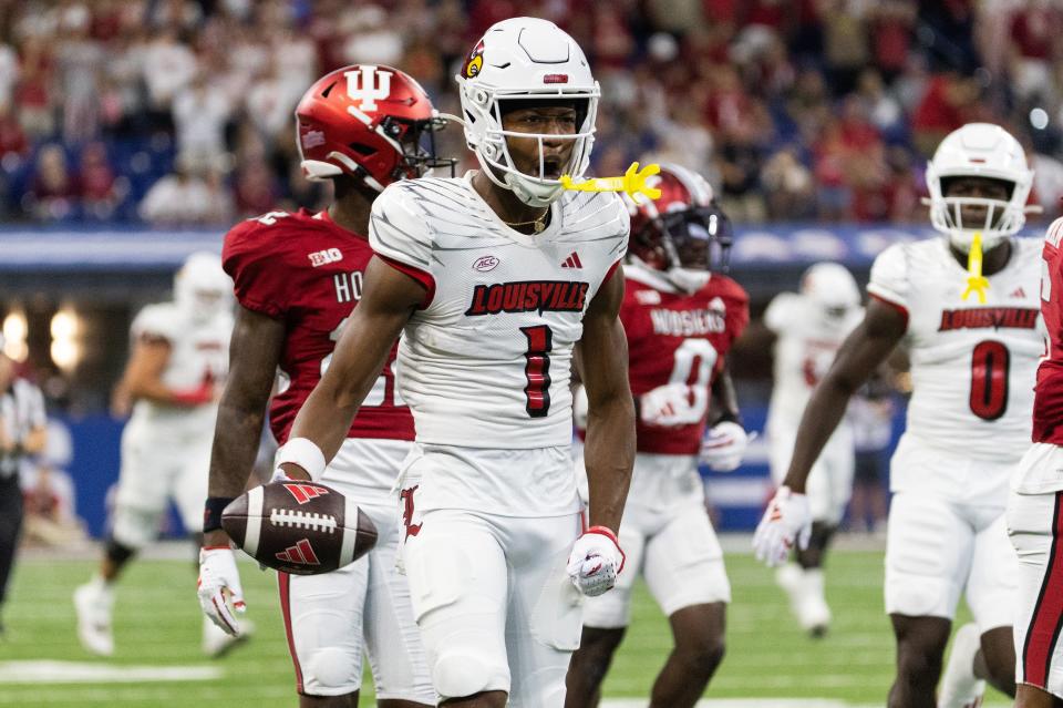 Louisville Cardinals wide receiver Jamari Thrash (1) celebrates after catching a pass for a first down against Indiana Hoosiers defensive back Phillip Dunnam (6) in the first quarter at Lucas Oil Stadium on Sept. 16, 2023 in Indianapolis, Indiana.