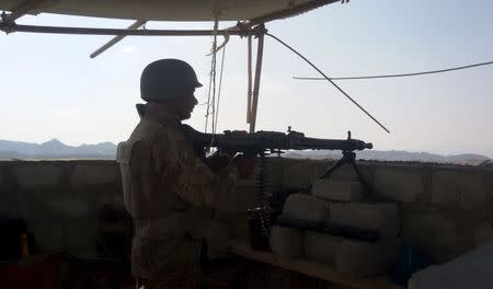 A soldier mans a gun at a check post of a construction site on the outskirts of Gwadar, Pakistan January 26, 2016.