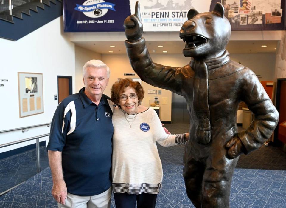 Glenn and Berni Sheaffer stand with the Nittany Lion mascot statue in the Penn State All-Sports Museum. The statue was donated by the Back the Lions group. The Sheaffers are members of the group that's celebrating its 50th anniversary this year.