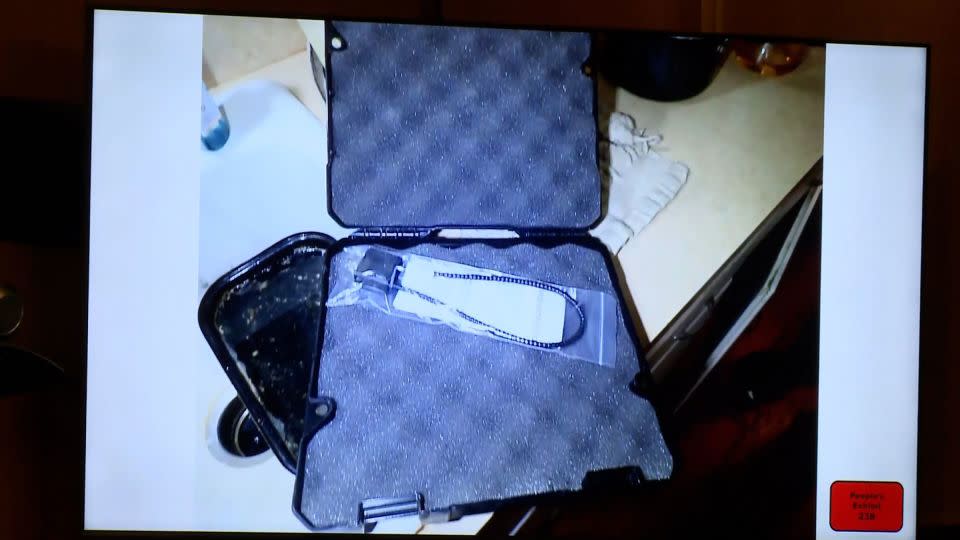 The cable lock that was sold with the SIG Sauer 9mm firearm was still in its plastic wrapping in the Crumbley home, a detective testified. - Pool/WWJ/WXYZ