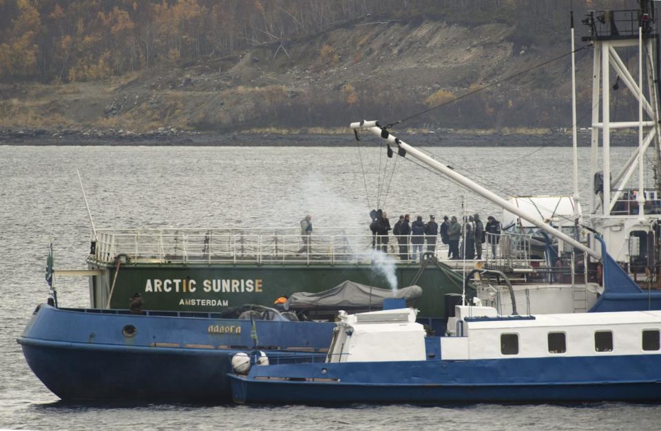 Captain Peter Willcox and federal Investigative Committee employees and Interior Ministry members are seen onboard the Arctic Sunrise vessel anchored outside Murmansk