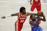 Brooklyn Nets forward Kevin Durant, right, is defended by Atlanta Hawks' Solomon Hill (18) during the first half of an NBA basketball game Wednesday, Jan. 27, 2021, in Atlanta. (AP Photo/Brynn Anderson)