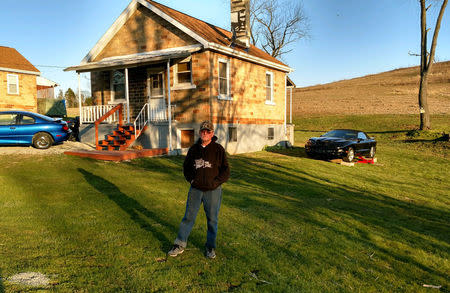 David Stawovy, owner and manager of the town, poses in front of one of the houses in Reduction, Pennsylvania, March 23, 2017. Photo courtesy of Patricia Stawovy/Handout via REUTERS