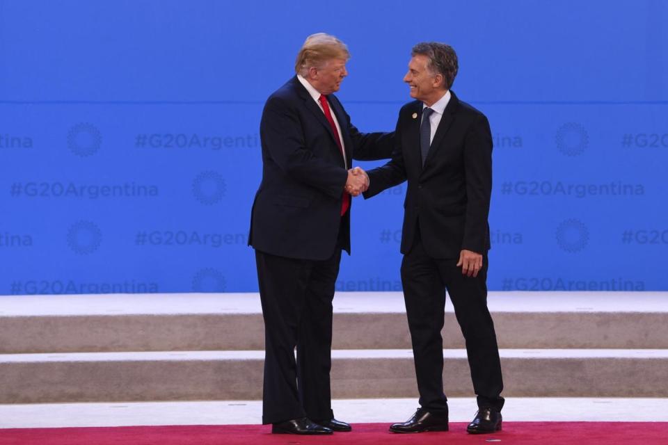 Trump and Macri shake hands as the summit draws to a close (EPA)