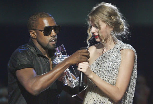 Kanye West invading the stage as Taylor Swift accepts her VMA in 2009 (AP)