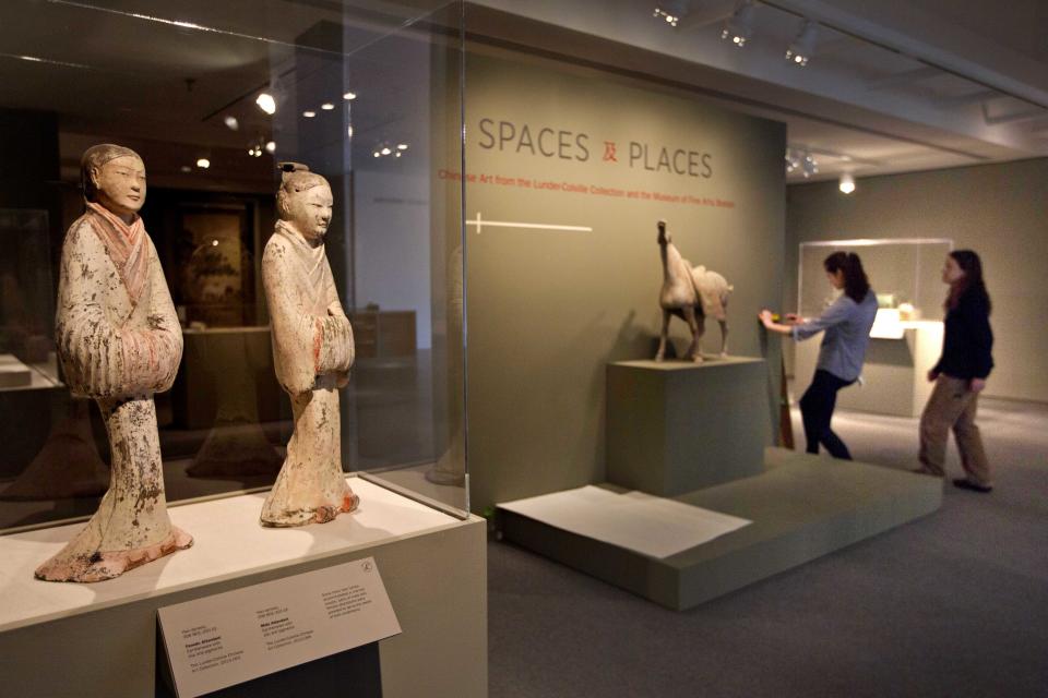 In this photo made Friday, June 28, 2013, museum employees install a collection of Chinese art at the Colby College Museum of Art, in Waterville, Maine. The works are part of the Lunder Collection. AP Photo/Robert F. Bukaty)