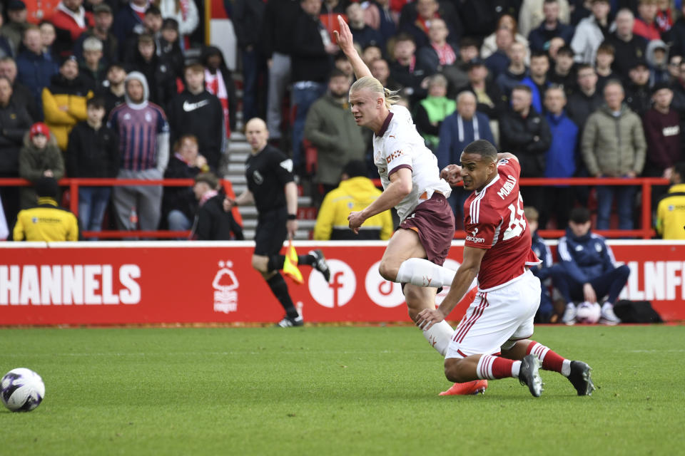 Manchester City's Erling Haaland scores his side's 2nd goal during the English Premier League soccer match between Nottingham Forest and Manchester City at the City Ground stadium in Nottingham, England, Sunday, April 28, 2024. (AP Photo/Rui Vieira)