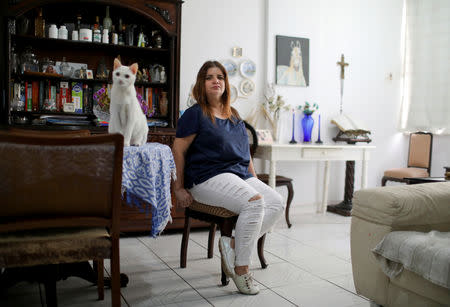 Lawyer Sandra Nicacio, 54, supporter of Brazil's presidential candidate Jair Bolsonaro, poses for a portrait at her home in Rio de Janeiro, Brazil, October 19, 2018. REUTERS/Pilar Olivares