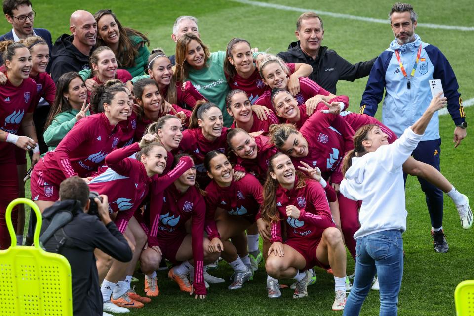 Spain's team coach, Jorge Vilda (R), poses for a photograph with players during a training session at Leichhardt Oval on Friday in Sydney ahead of the Women's World Cup final between Spain and England. (Photo by David Gray/AFP via Getty Images)