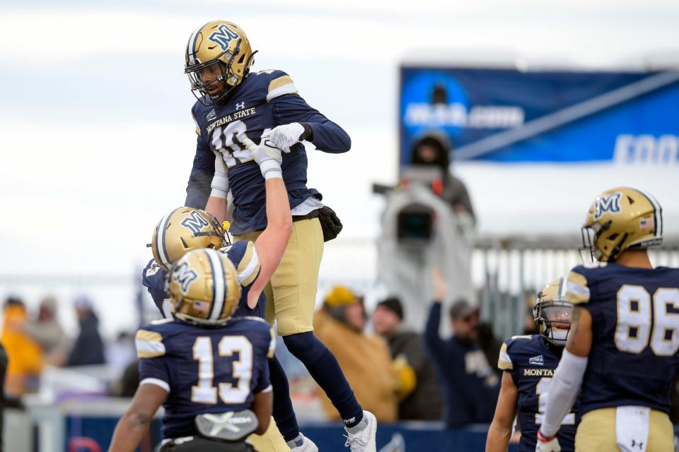 Montana State wide receiver Nate Stewart (10) celebrates with teammates after a touchdown during an NCAA college football game against South Dakota State in the semifinals of the FCS playoffs, Saturday, Dec. 18, 2021, in Bozeman, Mont. (AP Photo/Tommy Martino)