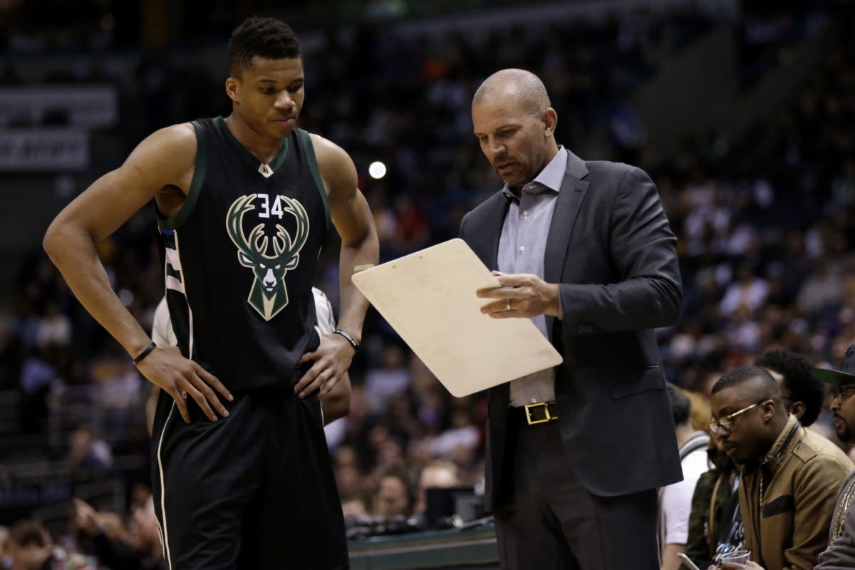 Jason Kidd shows Giannis Antetokounmpo his resume, probably. (Getty Images)