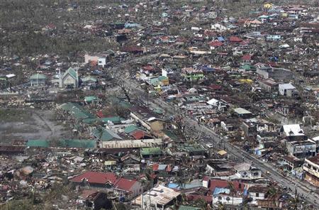 An aerial view shows damaged houses brought by Typhoon Haiyan in the province of Leyte, central Philippines November 10, 2013. REUTERS/Ryan Lim/Malacanang Photo Bureau/Handout via Reuters