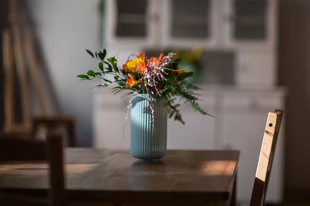 Don't make the host scramble to find a vase for your flowers. (Photo: IzaLysonArts / 500px via Getty Images)