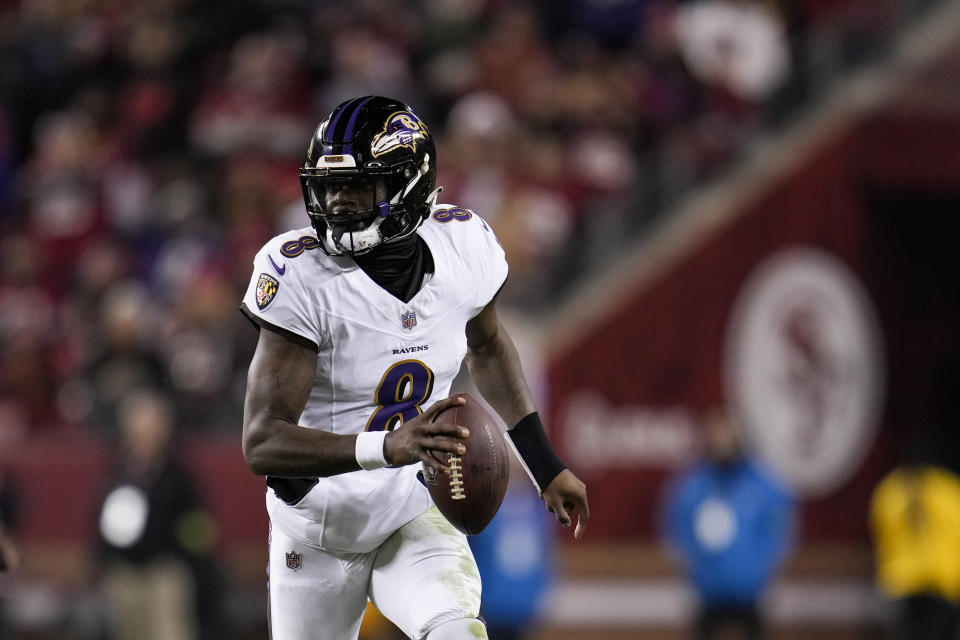 Baltimore Ravens quarterback Lamar Jackson looks for a receiver against the San Francisco 49ers during the first half of an NFL football game Monday, Dec. 25, 2023, in Santa Clara, Calif. (AP Photo/Godofredo A. Vásquez)