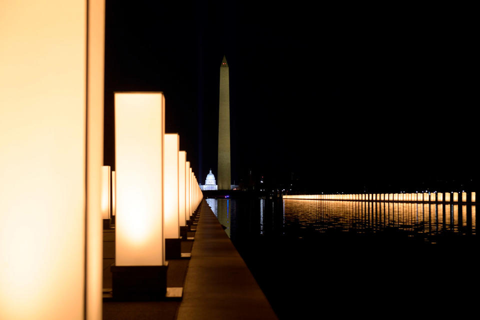 <p>The reflecting pool was lit to "honor those who have died" throughout the ongoing pandemic, the Presidential Inaugural Committee previously said.</p>