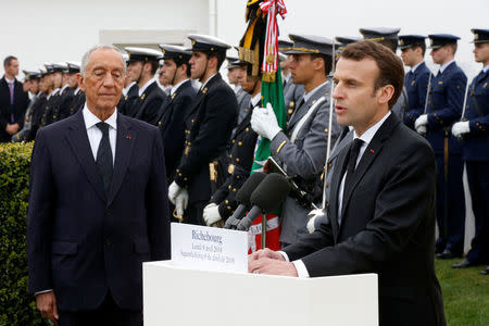 French President Emmanuel Macron and Portuguese President Marcelo Rebelo de Sousa attend a World War One remembrance ceremony of the battle of la Lys at WW1 Portuguese cemetery in Richebourg, France, April 9, 2018. REUTERS/Pascal Rossignol/Pool