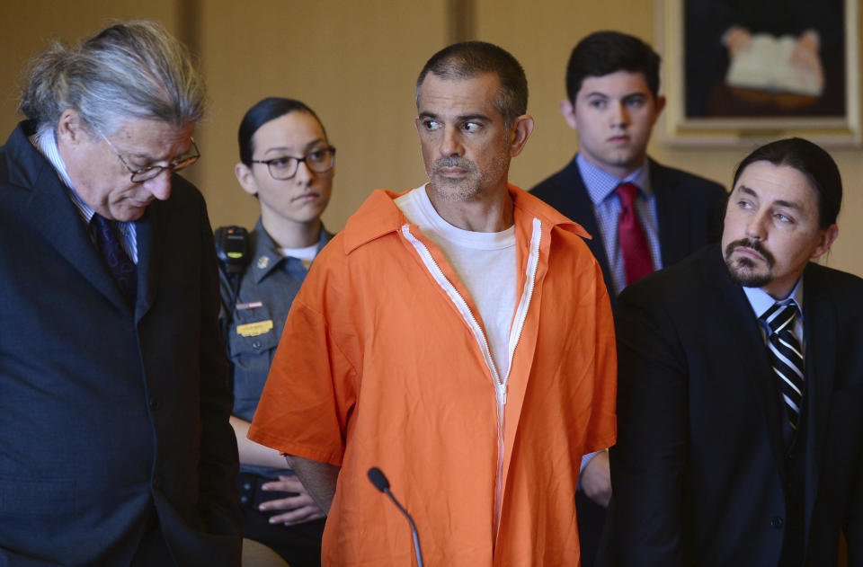 Fotis Dulos and his legal team including Norm Pattis, left, stand during a hearing at Stamford Superior Court, Tuesday, June 11, 2019 in Stamford, Conn. Fotis Dulos, and his girlfriend, Michelle Troconis, have been charged with evidence tampering and hindering prosecution in the disappearance of his wife Jennifer Dulos. The mother of five has has been missing since May 24. (Erik Trautmann/Hearst Connecticut Media via AP, Pool)
