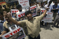 FILE- In this May 23, 2008 file photo, Sri Lankan journalists shout slogans during a protest demanding the government investigate into abduction and assault of fellow journalist Keith Noyahr in Colombo, Sri Lanka. Forced to flee their country a decade ago to escape allegedly state-sponsored killer squads, Sri Lankan journalists living in exile doubt they’ll be able to return home soon or see justice served to their tormentors _ whose alleged ringleader could come to power in this weekend’s presidential election. Exiled journalists and media rights groups are expressing disappointment over the current government’s failure in punishing the culprits responsible for crimes committed against media members. (AP Photo/Eranga Jayawardena, File)
