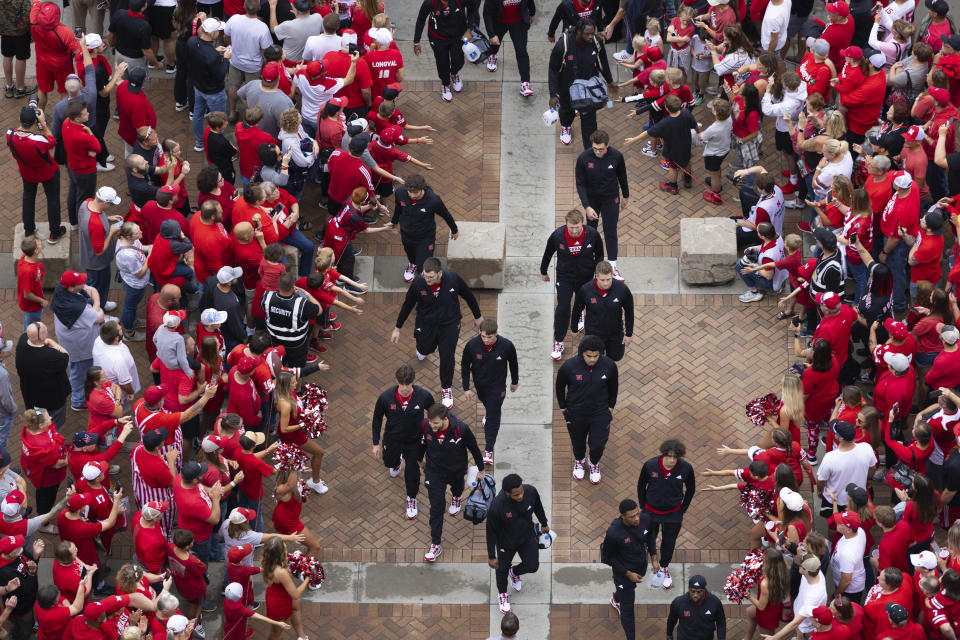 Fans welcome the Nebraska football team as they arrive at Memorial Stadium to play against Louisiana Tech iin an NCAA college football game Saturday, Sept. 23, 2023, in Lincoln, Neb. (AP Photo/Rebecca S. Gratz)