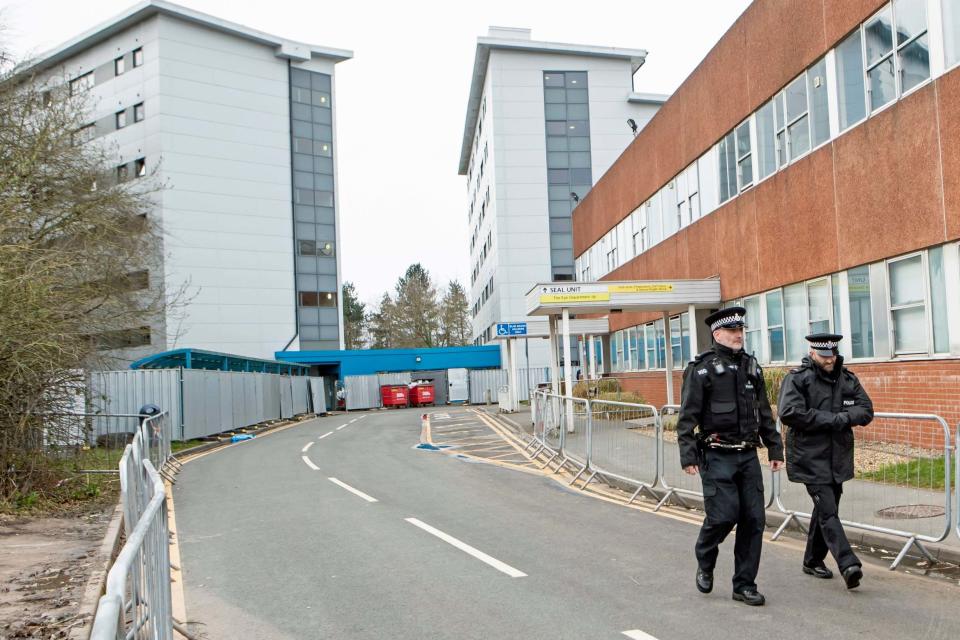 Police outside the buildings at Arrowe Park Hospital (PA)