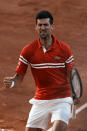 Serbia's Novak Djokovic celebrates defeating Stefanos Tsitsipas of Greece in their final match of the French Open tennis tournament at the Roland Garros stadium Sunday, June 13, 2021 in Paris. Djokovic won 6-7, 2-6, 6-3, 6-2, 6-4. (AP Photo/Thibault Camus)