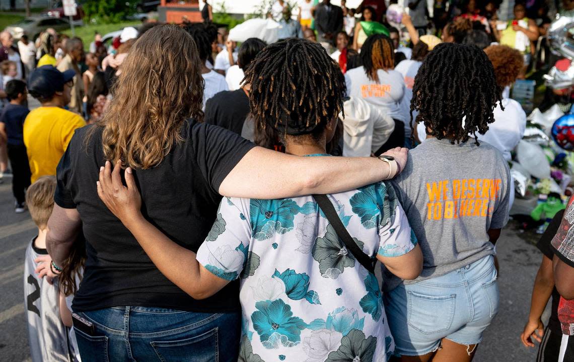 People gather to pray during a vigil for 6-year-old Sir’Antonio Brown on Wednesday, May 10, 2023, in Kansas City, Kan. Brown was killed May 3 while playing outside his home.