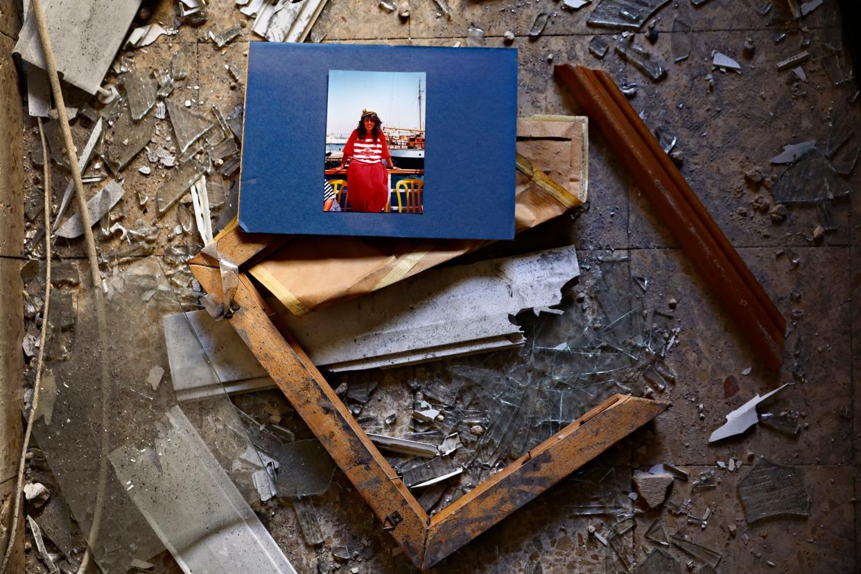 A picture and broken frame lay in an apartment after it was hit by a rocket fired from the Gaza Strip overnight in Petah Tikva, central Israel, Thursday, May 13, 2021.