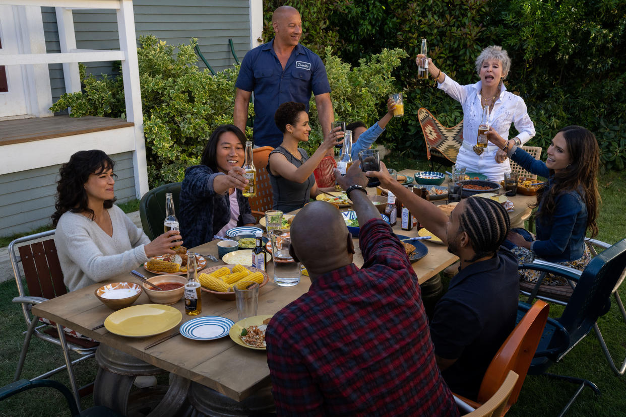 Letty (Michelle Rodriguez), Han (Sung Kang), Ramsey (Nathalie Emmanuel), Dom (Vin Diesel), Little Brian (Leo Abelo Perry), Abuelita (Rita Moreno), Mia (Jordana Brewster), Tej (Chris ‘Ludacris’ Bridges, back to camera) and Roman (Tyrese Gibson, back to camera) in Fast X