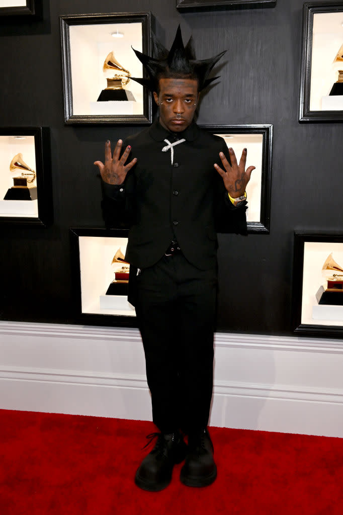 Lil Uzi Vert in all-black with spiky hair.