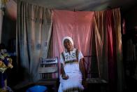 Follower of the Afro-Cuban religion Santeria sits before a ceremony amid concerns about the spread of the coronavirus disease outbreak in Havana