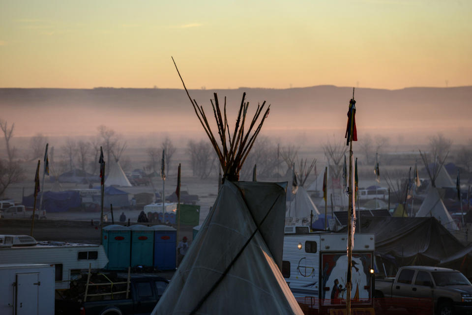 A tipi is seen at sunrise at an encampment.