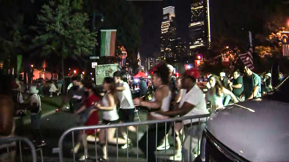 Various people could be seen running from near the Benjamin Franklin Parkway after reports of two officers reportedly being shot in Philadelphia on July 4, 2022. (NBC Philadelphia)