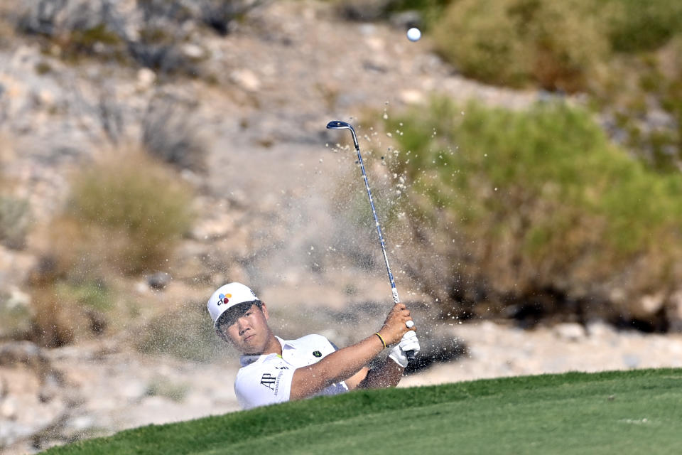 Tom Kim, of South Korea, take a shot from the bunker on the fifth hole during the final round of the Shriners Children's Open golf tournament, Sunday, Oct. 9, 2022, in Las Vegas. (AP Photo/David Becker)