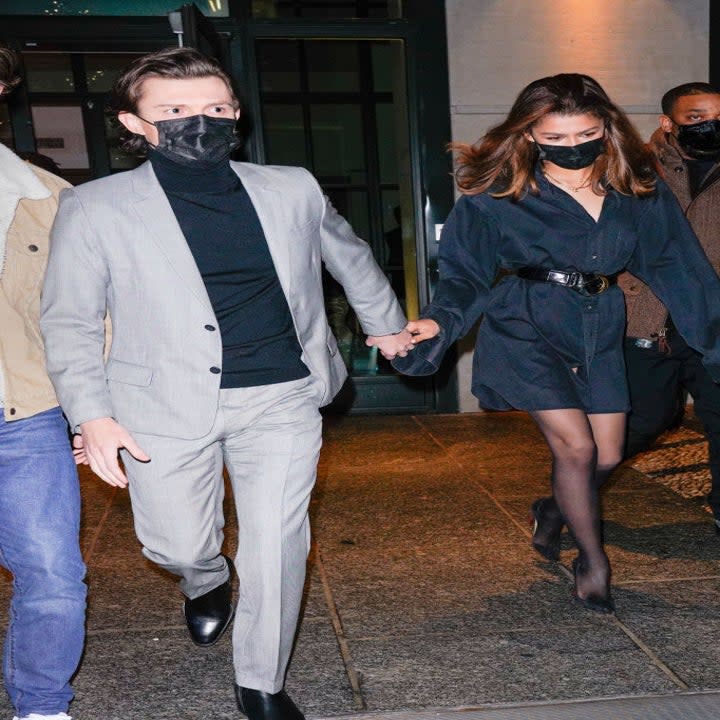 Tom (L) and Zendaya (R) walk hand in hand while leaving their hotel in New York City